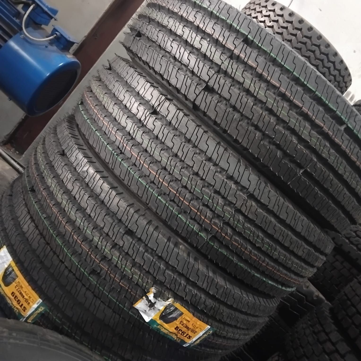 New Drivemaster 315/80R22.5 steer tyres stacked in the 3G Tyres warehouse