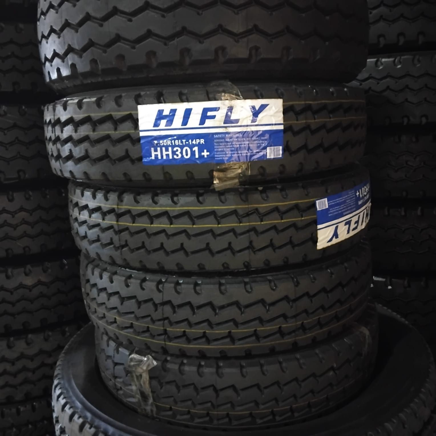 New Hifly 7.50R16 tyres stacked with their labels on