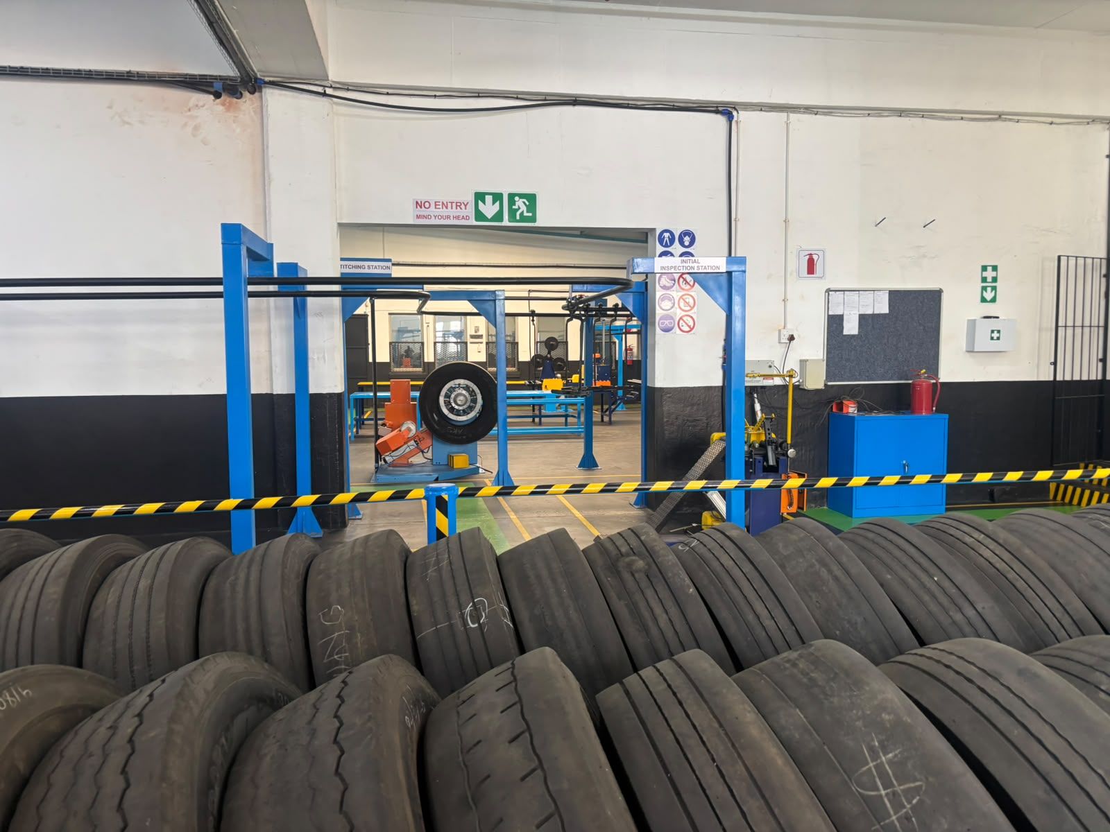Retread plant floor at 3G Tyres with casings racked at the dispatch end